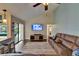Living area featuring a wet bar, comfortable seating, hardwood floors, and access to a pool area at 907 Golf Island Dr, Apollo Beach, FL 33572