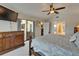 This main bedroom includes a ceiling fan, slider to the patio, and bathroom at 907 Golf Island Dr, Apollo Beach, FL 33572