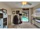 This office features a pool view, plenty of storage and neutral colors at 907 Golf Island Dr, Apollo Beach, FL 33572