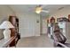 Neutral toned office space includes closet storage, and ceiling fan with a light at 907 Golf Island Dr, Apollo Beach, FL 33572