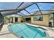 Sparkling pool in a screened enclosure, creating a private outdoor oasis for swimming and relaxation at 907 Golf Island Dr, Apollo Beach, FL 33572