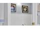 Clean half bathroom with white wainscoting and decorative wall art at 9520 Indale Dr, New Port Richey, FL 34654