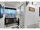 Modern bathroom with patterned tile, decorative wall art, and a glass-enclosed shower at 9520 Indale Dr, New Port Richey, FL 34654