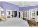 Spacious primary bedroom with hardwood floors, high ceilings, and ample closet space at 9520 Indale Dr, New Port Richey, FL 34654