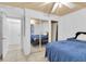 Bedroom with mirrored closet doors reflecting the room and an adjacent doorway at 9520 Indale Dr, New Port Richey, FL 34654