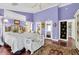 Cozy bedroom with high ceilings, hardwood floors, lots of natural light, and a decorative bench at 9520 Indale Dr, New Port Richey, FL 34654