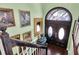 Inviting foyer showcasing beautiful hardwood floors and arched doorway at 9520 Indale Dr, New Port Richey, FL 34654