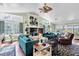 Spacious living room with vaulted ceilings, hardwood floors, and abundant natural light at 9520 Indale Dr, New Port Richey, FL 34654