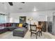 Spacious living room featuring tile floors, neutral walls, and a comfortable sectional sofa at 9520 Indale Dr, New Port Richey, FL 34654