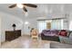 Cozy living area with a comfortable sectional, tile floors, and a decorative chair at 9520 Indale Dr, New Port Richey, FL 34654
