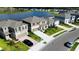 Aerial view of the homes, showcasing the community layout, landscaping, and proximity to the surrounding areas at 9567 Sandy Bluffs Cir, Parrish, FL 34219