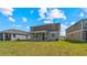 Expansive backyard offering ample space for outdoor activities and potential for landscaping and recreational features at 9567 Sandy Bluffs Cir, Parrish, FL 34219