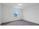 Bedroom features carpet flooring, neutral walls, and window at 9567 Sandy Bluffs Cir, Parrish, FL 34219