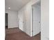 Hallway with multiple doors, potentially leading to bedrooms or other living spaces at 9567 Sandy Bluffs Cir, Parrish, FL 34219