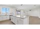 Bright kitchen features a center island with granite countertops and modern appliances at 9567 Sandy Bluffs Cir, Parrish, FL 34219