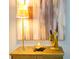 Table setting with table lamp, decorative statue, and candle at 960 Starkey Rd # 9104, Largo, FL 33771