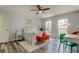 Bedroom with bright light, two windows, and wood style flooring at 9814 Ashburn Lake Dr, Tampa, FL 33610