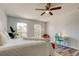 Bedroom with bright light, two windows, and wood style flooring at 9814 Ashburn Lake Dr, Tampa, FL 33610