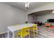 Dining room with a modern table and a view of the cozy living room at 9814 Ashburn Lake Dr, Tampa, FL 33610