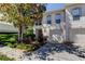 Charming two-story townhouse with well-maintained landscaping and attached one car garage at 9814 Ashburn Lake Dr, Tampa, FL 33610