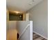 Hallway with wooden floors and gray walls with lighting and air-conditioning at 9814 Ashburn Lake Dr, Tampa, FL 33610