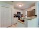 Well-lit kitchen with stainless steel appliances and granite countertops at 9814 Ashburn Lake Dr, Tampa, FL 33610