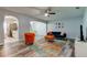 Inviting living room with stylish decor, including a colorful rug and modern furniture at 9814 Ashburn Lake Dr, Tampa, FL 33610