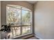 Arched window offers a view of the neighborhood in a naturally lit room at 9814 Ashburn Lake Dr, Tampa, FL 33610