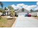 Charming single-Gathering home with a two-car garage and a well-maintained front yard at 10021 Elgin Blvd, Spring Hill, FL 34608