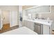 White kitchen featuring stainless steel dishwasher and view to dining area at 10021 Elgin Blvd, Spring Hill, FL 34608