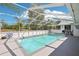 Refreshing pool area with ample space for lounging and entertaining, surrounded by a screened enclosure at 10021 Elgin Blvd, Spring Hill, FL 34608