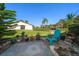 Serene backyard patio with lush green lawn and landscaping, perfect for outdoor relaxation at 11511 113Th St # 24C, Largo, FL 33778