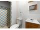 Cozy bathroom features a sink and toilet next to a shower with blue and yellow tiling at 1205 E Emma St, Tampa, FL 33603