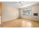 A clean, spacious bedroom with a window for natural light and a classic tile floor at 1205 E Emma St, Tampa, FL 33603