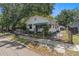 Charming single-story home with a fenced yard and mature trees offering shade at 1205 E Emma St, Tampa, FL 33603