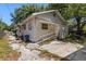 The exterior of the home features a ramp and access to the back yard at 1205 E Emma St, Tampa, FL 33603