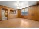 Comfortable living room with hardwood floors, and a view into the kitchen at 1205 E Emma St, Tampa, FL 33603