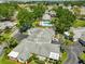 Overhead view showcasing mature trees, green spaces, and community landscaping at 1211 Golfview Woods Dr, Sun City Center, FL 33573