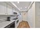 Efficient kitchen layout with stainless steel appliances and ample storage space at 1211 Golfview Woods Dr, Sun City Center, FL 33573