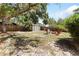 A backyard with a shed and firepit area with chairs at 1222 E Powhatan Ave, Tampa, FL 33604