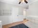 Well-lit bedroom featuring a futon, bright windows and a white dresser at 1222 E Powhatan Ave, Tampa, FL 33604