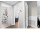 Hallway with view to the bathroom and living room at 1222 E Powhatan Ave, Tampa, FL 33604