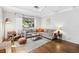 Bright and open living room featuring hardwood floors and ample natural light at 1222 E Powhatan Ave, Tampa, FL 33604