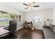 Bright office space featuring hardwood floors, a desk and a comfortable couch at 1222 E Powhatan Ave, Tampa, FL 33604