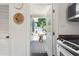View from kitchen to the outside porch with seating and shed in the backyard at 1222 E Powhatan Ave, Tampa, FL 33604