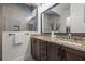 Elegant bathroom with a double vanity, granite countertops, and a glass-enclosed shower at 14493 Promenade Pkwy, Odessa, FL 33556