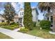 Attractive two-story home with lush landscaping, a well-maintained lawn, and a welcoming curb appeal at 14493 Promenade Pkwy, Odessa, FL 33556
