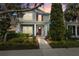 Charming two-story home with well-manicured landscaping and a welcoming front porch at 14493 Promenade Pkwy, Odessa, FL 33556