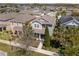 An elevated view of a meticulously kept two-story home with an attractive exterior and manicured landscaping at 14493 Promenade Pkwy, Odessa, FL 33556