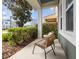 Cozy front porch with comfortable seating, perfect for enjoying the outdoors in a relaxed setting at 14493 Promenade Pkwy, Odessa, FL 33556